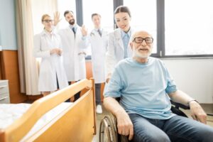 A happy elderly man being discharged from the hospital, expressing satisfaction with his care