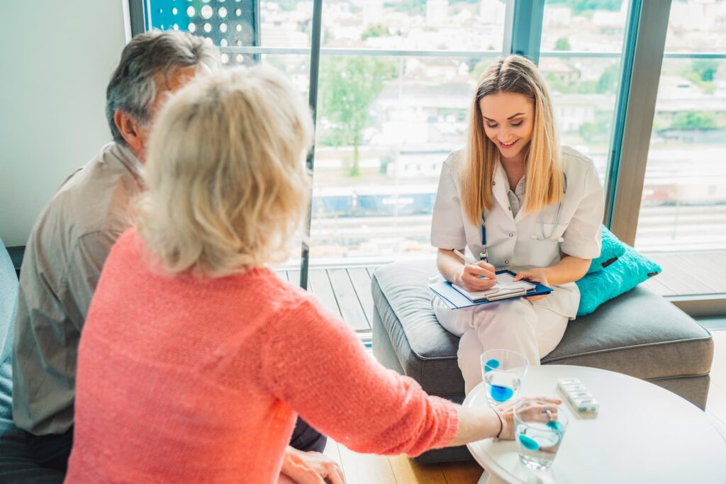 A doctor administering a survey to a patient in a hospital room to gather feedback