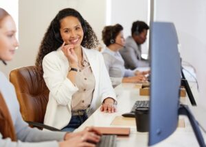Portrait of a young call centre agent working — Top BPO Solutions | Outsourcing Services In The Philippines